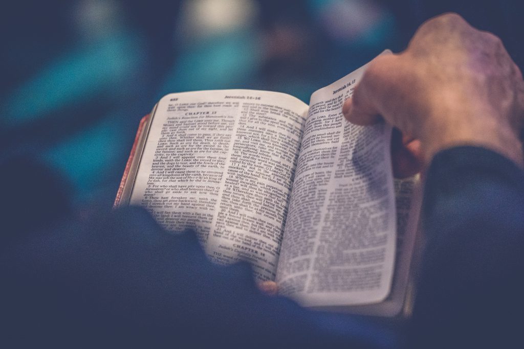 Man deepens his spiritual life by reading the Bible.