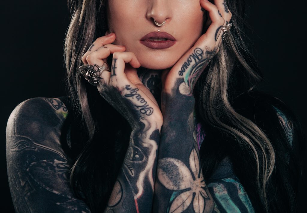 Orthodox Christian woman with tattoos on her arms