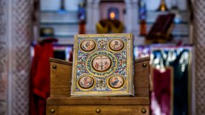 Golden book of Scripture on a stand