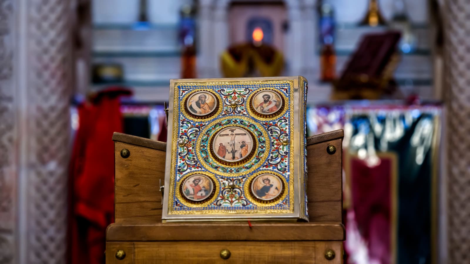 Golden book of Scripture on a stand