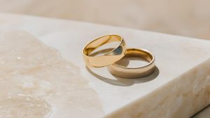 wedding rings on marble tabletop